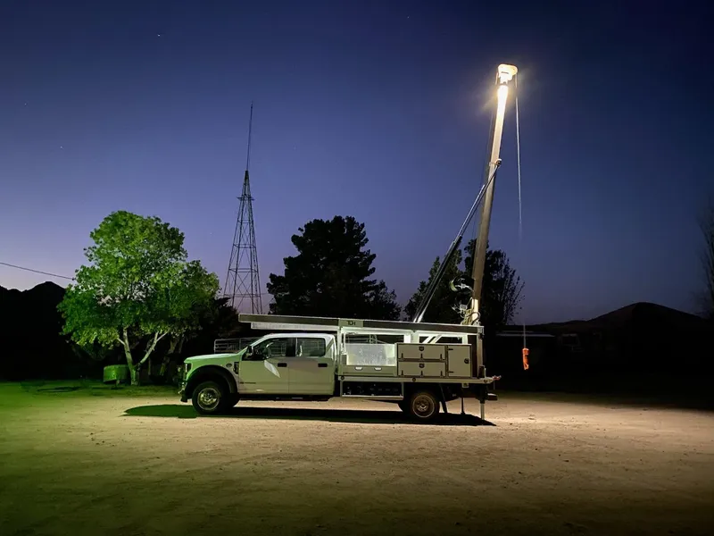 Well drilling service truck at night